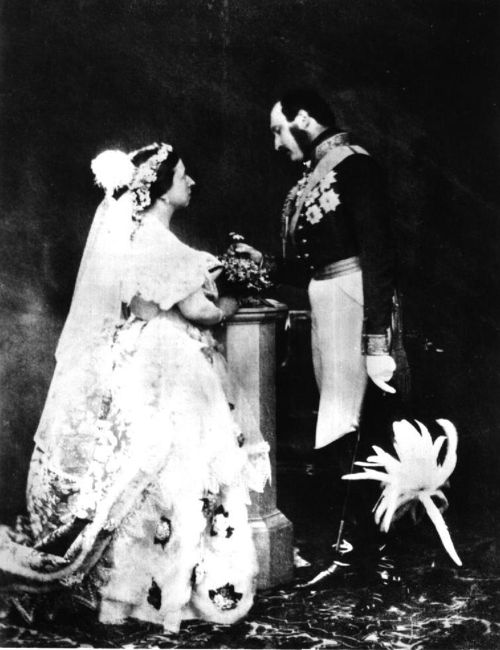 A middle aged Victoria and Albert recreate their wedding day