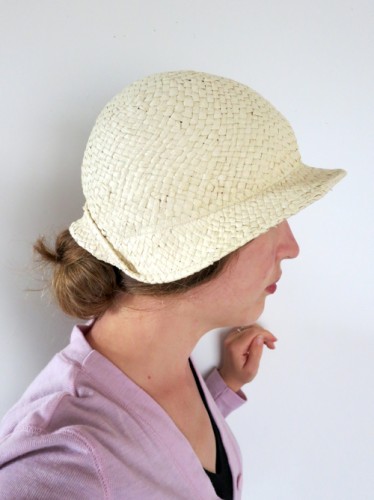 Hat held snugly on by hat elastic