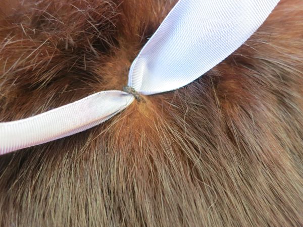 Working a bow-loop into a fur muff thedreasmtress.com