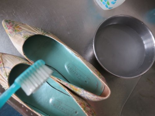 You want to clean the shoes while keeping them as dry as possible, so it's important to get most of the water off of your toothbrush, so the shoe gets barely damp.