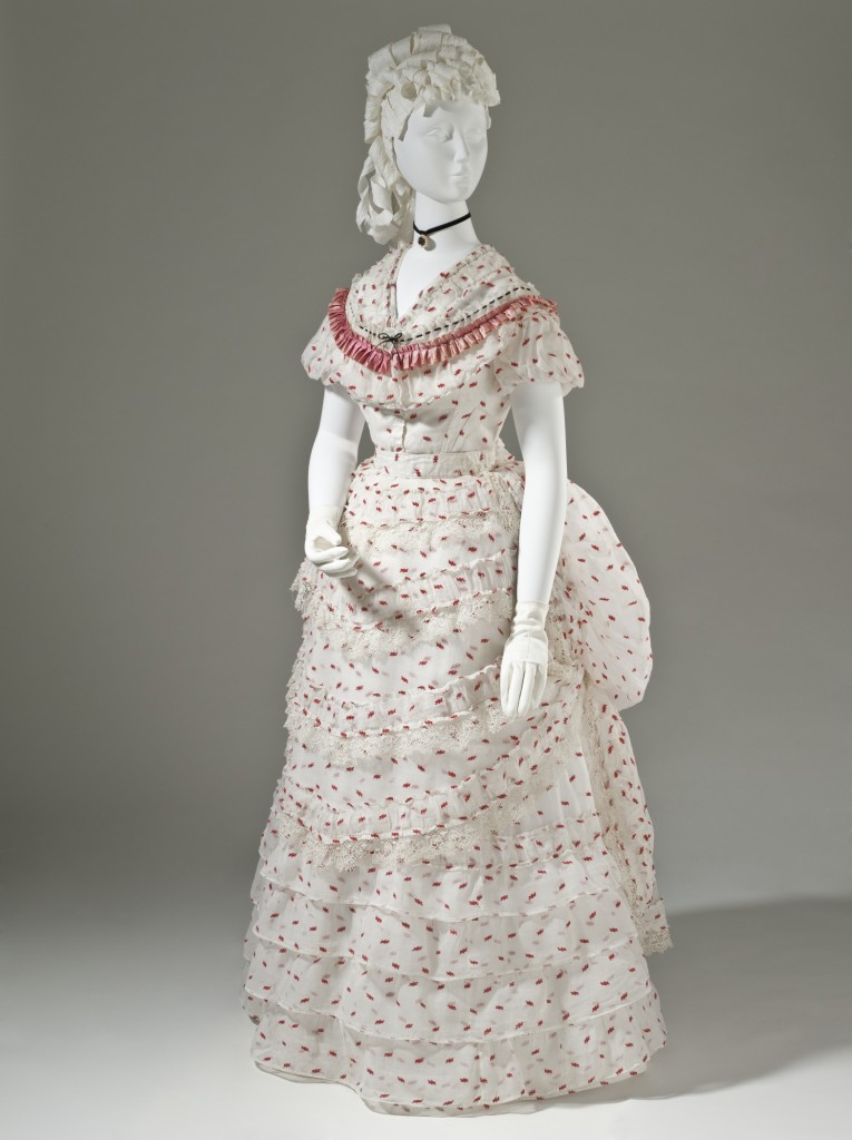 Woman's Polonaise Dress, England, circa 1875, Cotton plain weave with wool of discontinuous supplemental weft, silk satin ribbon, and machine lace, LACMA, M.2007.211.777a-f
