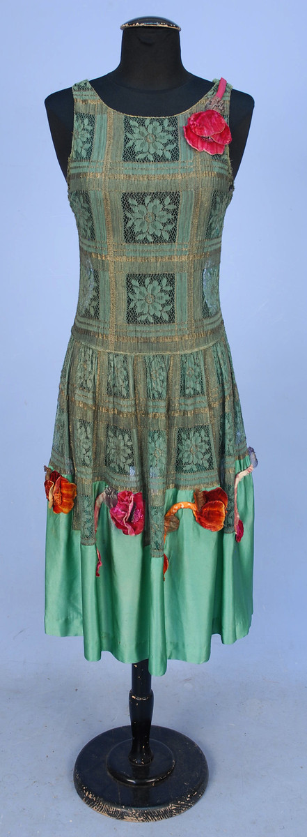 Evening dress of metal and cloth lace with silk charmeuse and appliqued silk velvet poppies, 1920s, sold by Whitaker Auctions