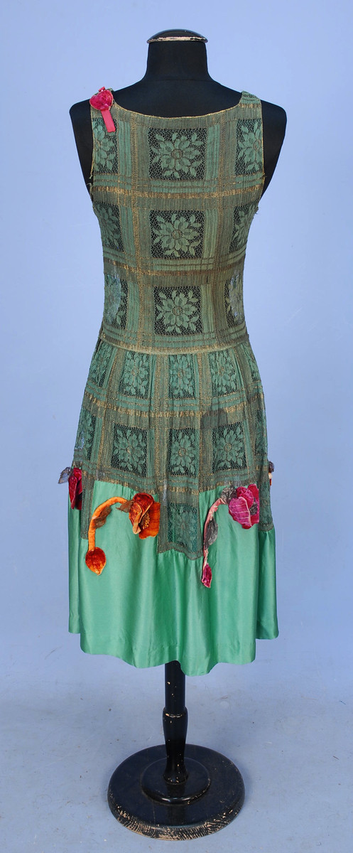 Evening dress of metal and cloth lace with silk charmeuse and appliquéd silk velvet poppies, 1920s, sold by Whitaker Auctions
