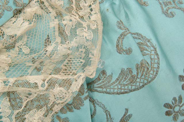 Evening dress of robins egg blue satin, brocaded in silver, with blond lace trim, Elizabeth Elser, Minneapolis, Minnesota, ca. 1914, Minnesota Historical Society, 8879.98