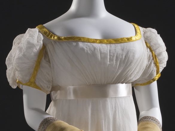 Woman’s Dress, France, circa 1820, Cotton gauze and cotton bobbin net with wool embroidery and silk satin trim, LACMA, M.2007.211.18