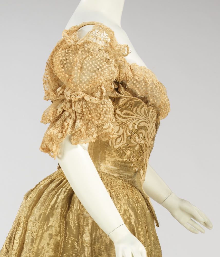 Afternoon gown, French (sold by Bon Marché), ca. 1880. Three-piece mushroom  silk faille with scallops, braidin…