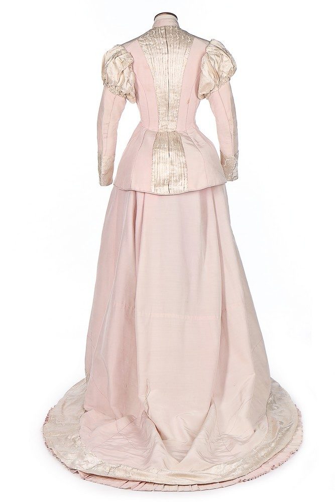 A pink faille and ivory damask historicist evening gown (dinner or reception?), 1875-80, sold by Kerry Taylor Auctions