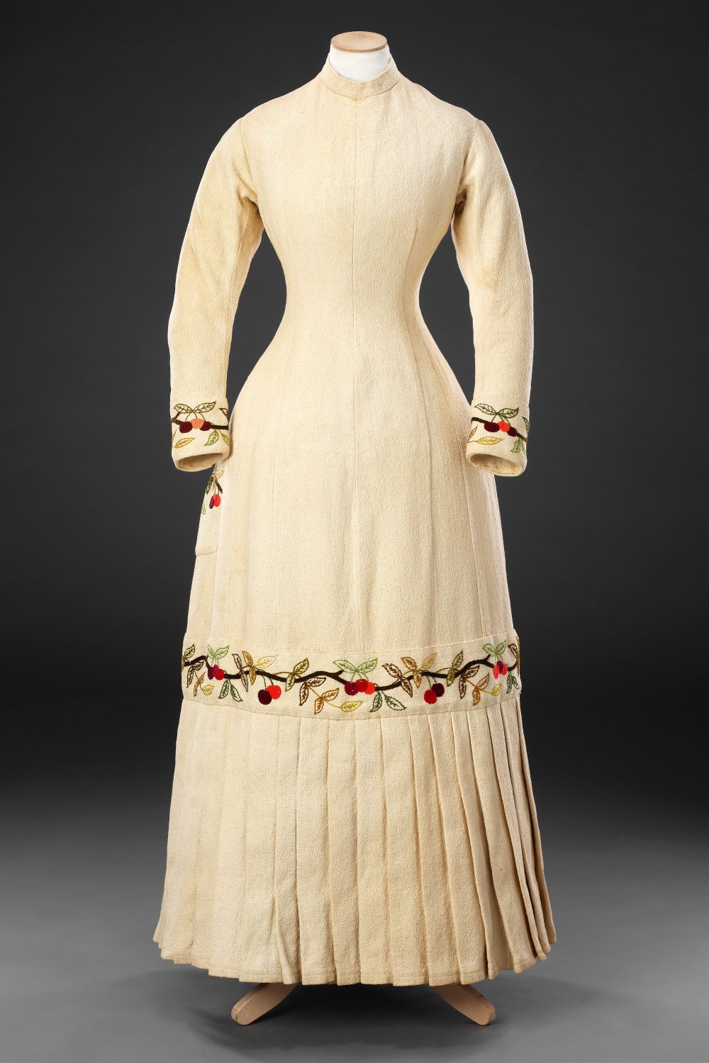 Dress, Circa 1880, Cotton embroidered with wool; mother of pearl buttons, John Bright Collection.jpg