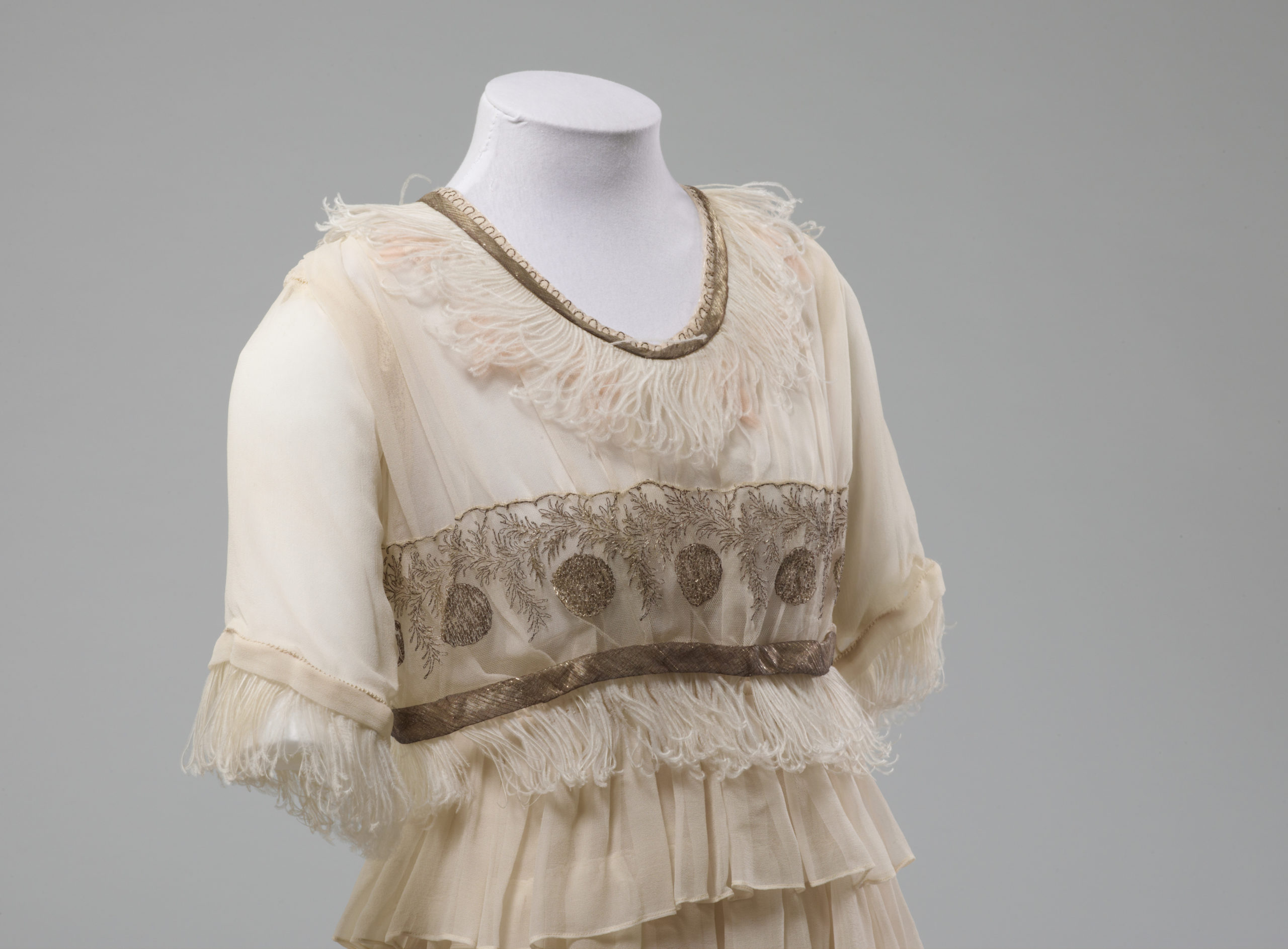 Wedding dress, Drapery Supply Association, 1920, Dunedin, Silk with feather and metallic thread trims and metal fastenings, PC003279, Gift of Mrs Tui Preston, 1984