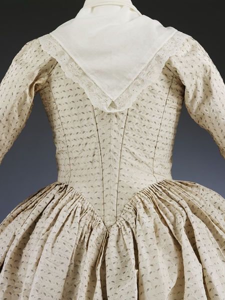 Gown and petticoat, 1779, English; white silk woven with silver, 1775-80, English, trimmed silver fringe, wedding; altered 1870-1910, Victoria and Albert Museum, T.80&A-1948
