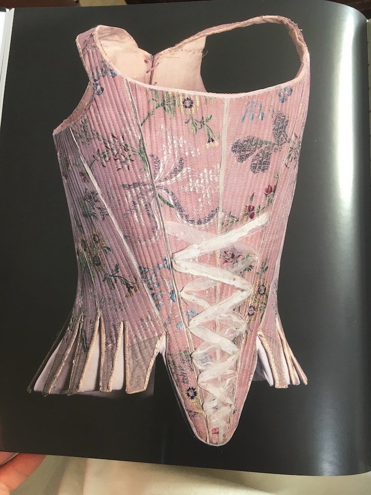 Stays of violet taffeta dated 1750-60, featured on page 110 of Stays or a Corset, Narodni Muzeum, Czechia