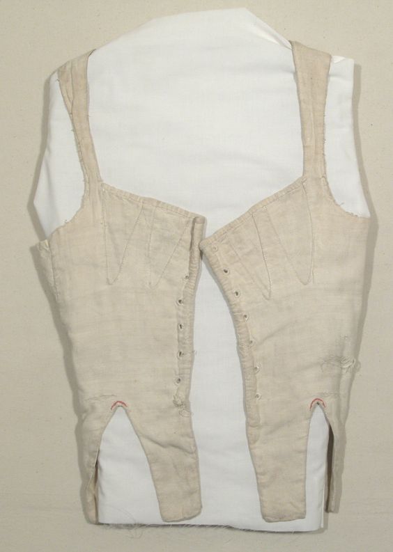 Corset, cotton, self lined. Fastens with 7 pairs of eyelet holes. Snowshill Wade Costume Collection, Gloucestershire, NT 1350125